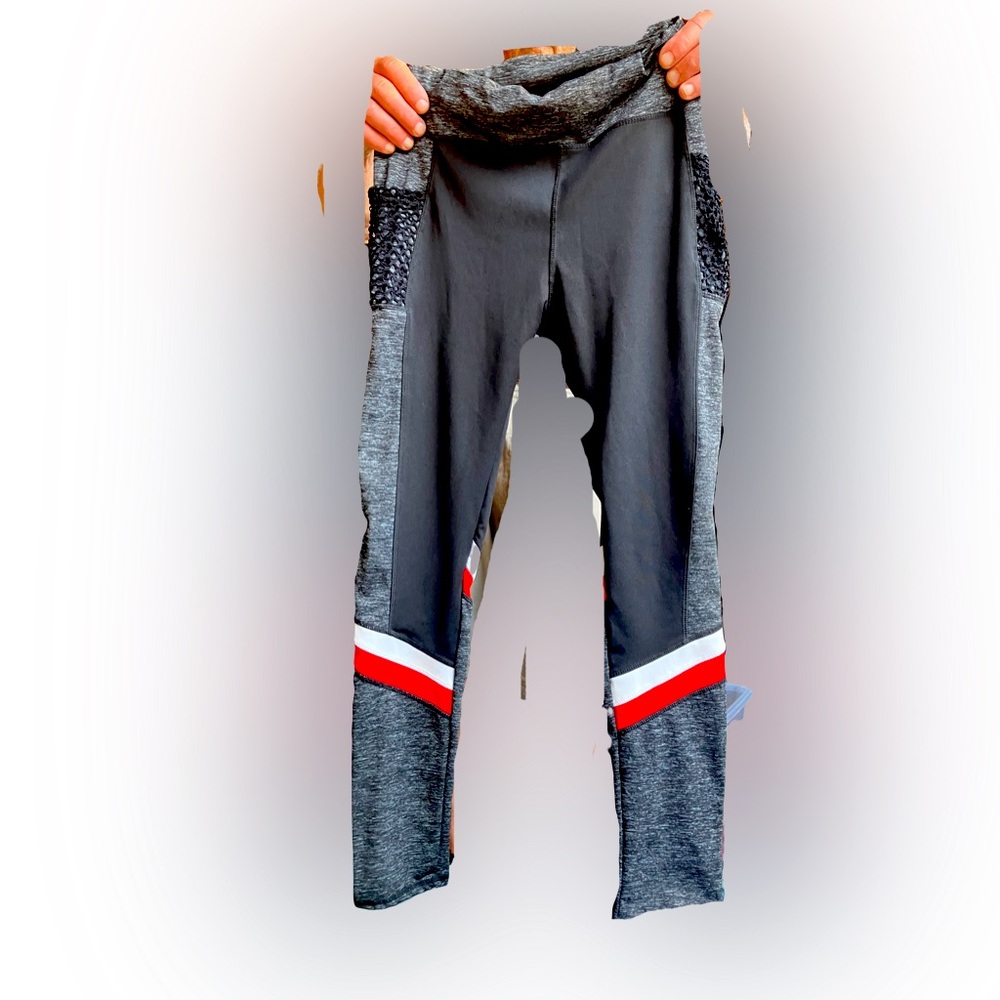 Size large/XL legging with side net pockets. Black with white, red and grey